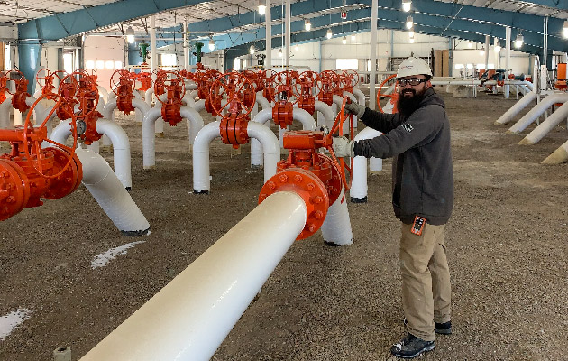 A NorthWestern Energy employee works in the Cut Bank natural gas facility